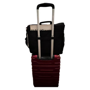 Black trombone mute bag attached to suitcase
