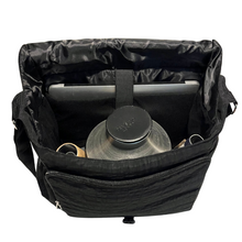 Load image into Gallery viewer, Interior of black trombone mute bag with mutes plus computer in the sleeve