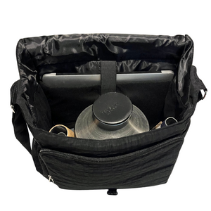 Interior of black trombone mute bag with mutes plus computer in the sleeve