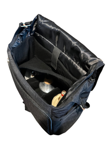 Interior of black mute bag showing bottom level and divider on top for second level
